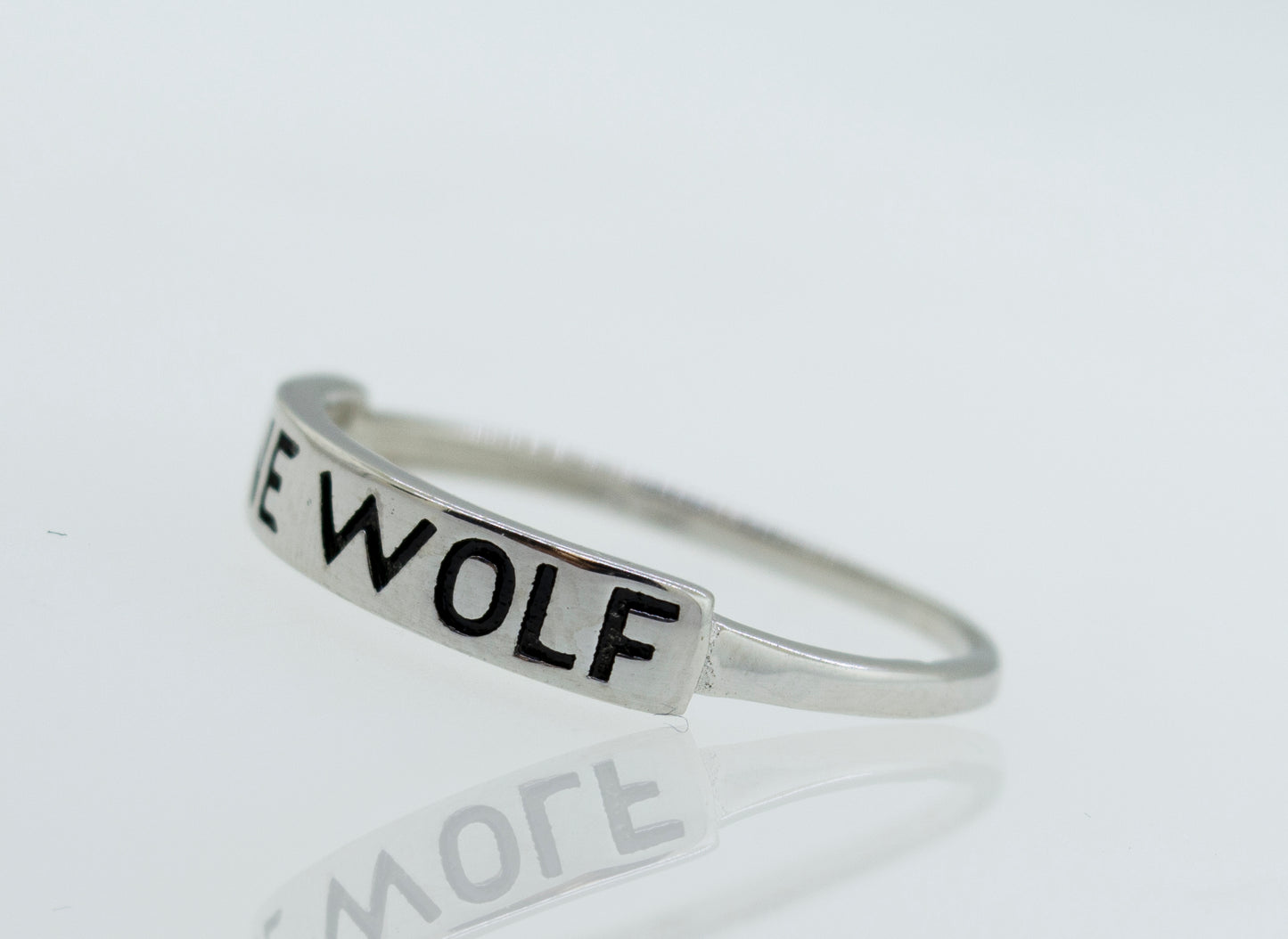 
                  
                    A Super Silver Silver Lone Wolf Ring with the word wolf on it.
                  
                