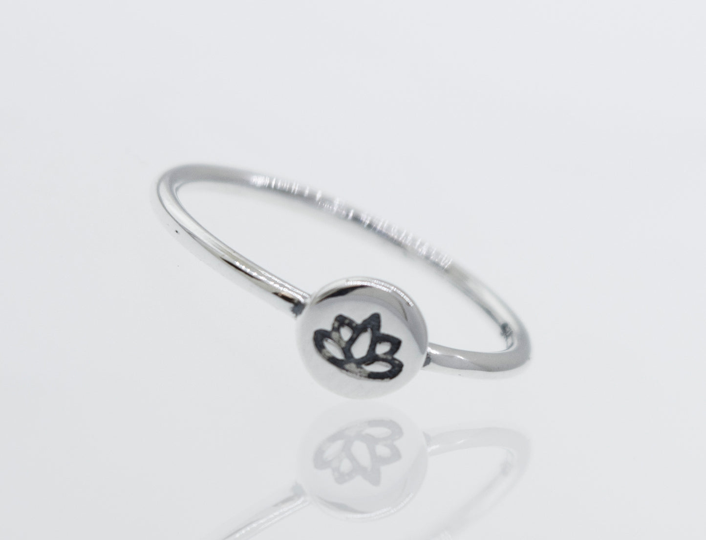 A modern Stackable Silver Lotus Ring adorned with a delicate lotus flower, inspired by nature's enchanting floral beauty.