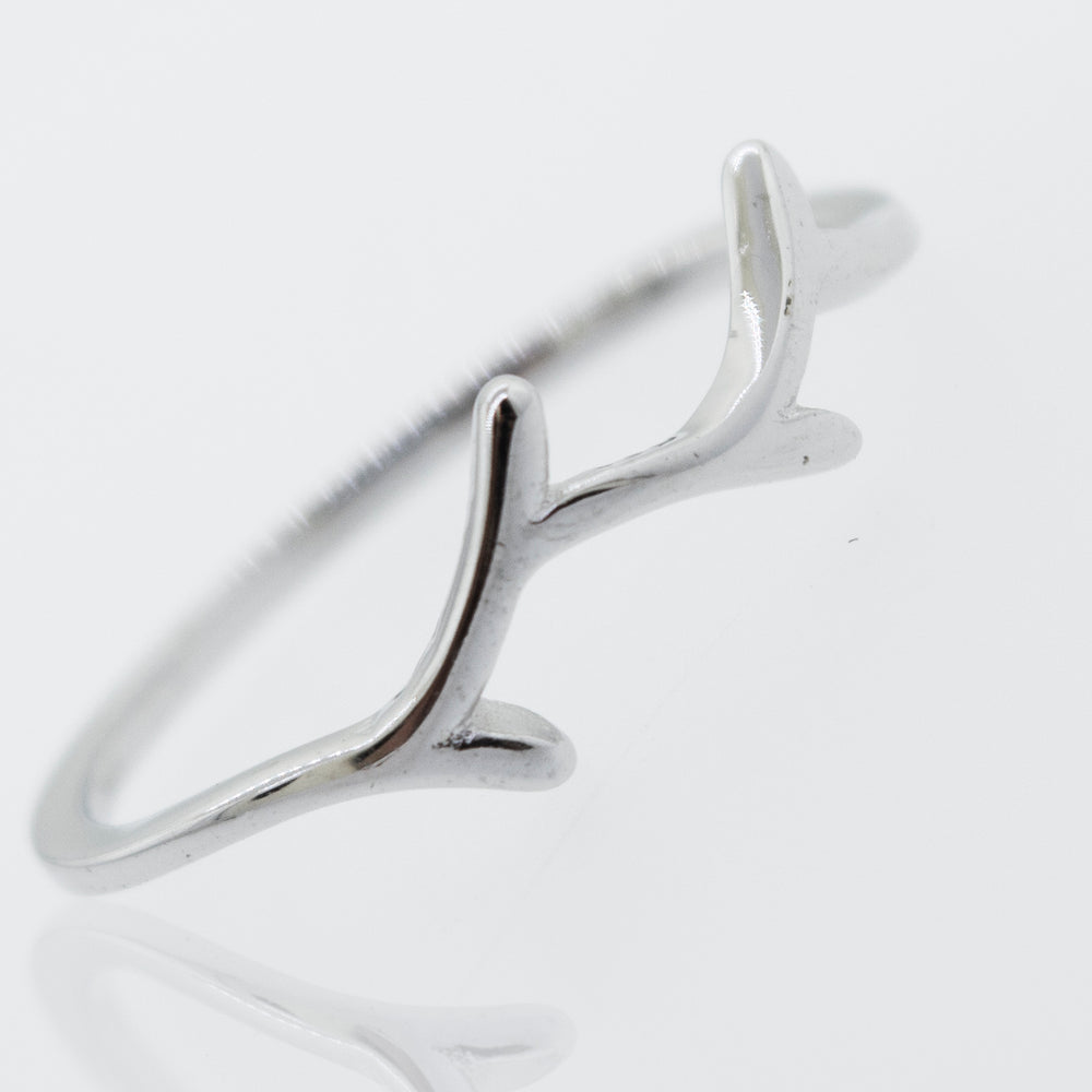 A Tree Branch Silver ring with antlers on it. (Brand Name: Super Silver)