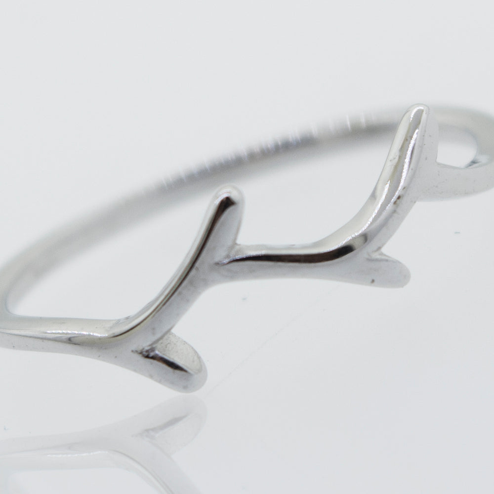 
                  
                    A Tree Branch Silver Ring with antlers on it, by Super Silver.
                  
                