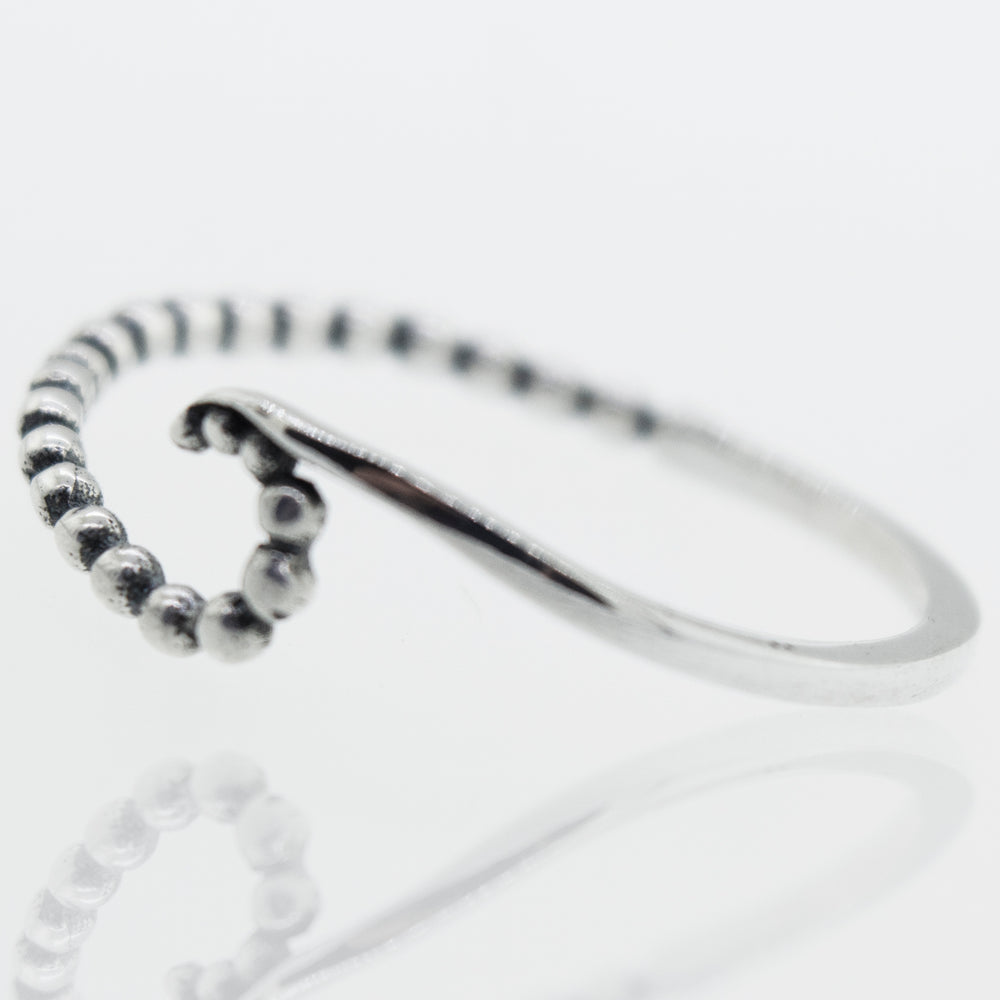 A modern sterling silver Wave Ring With Beads Design.