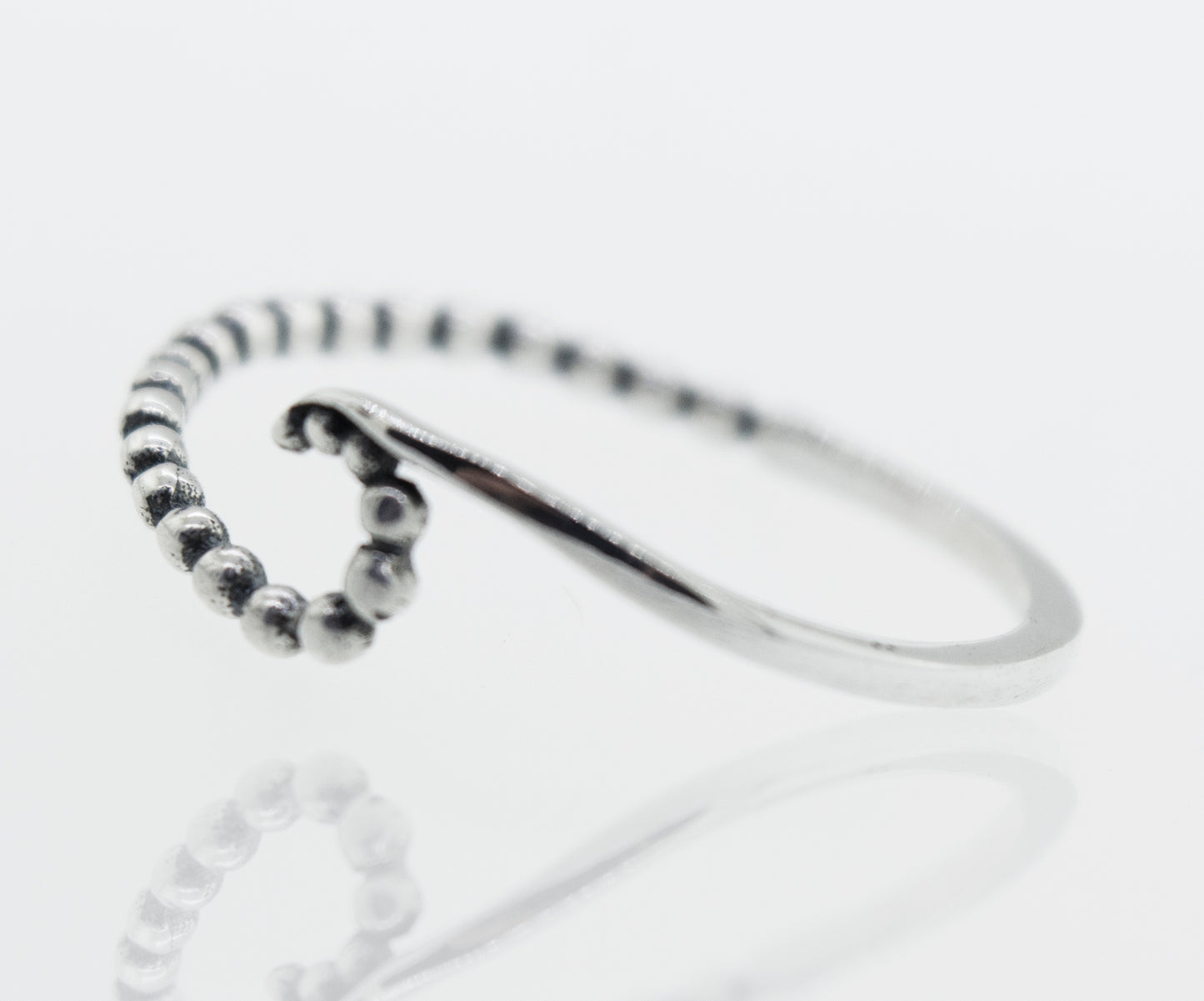 A modern sterling silver Wave Ring With Beads Design.