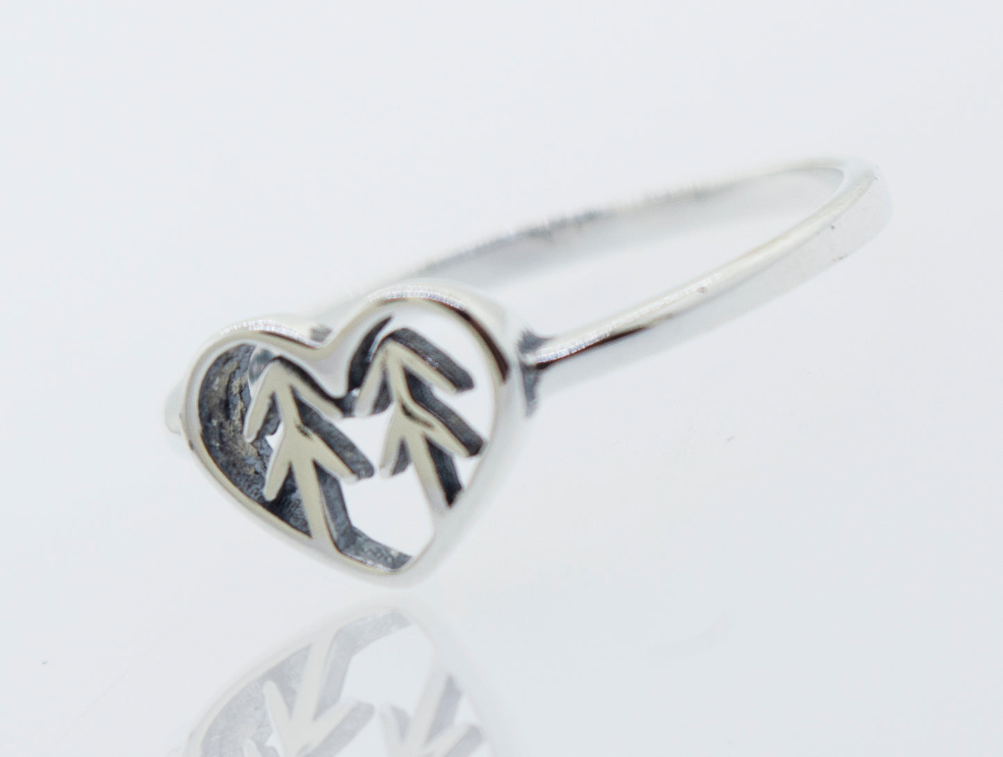 A Heart With Trees Silver Ring with a nature-inspired tree in the middle, symbolizing love and connection to the natural world.