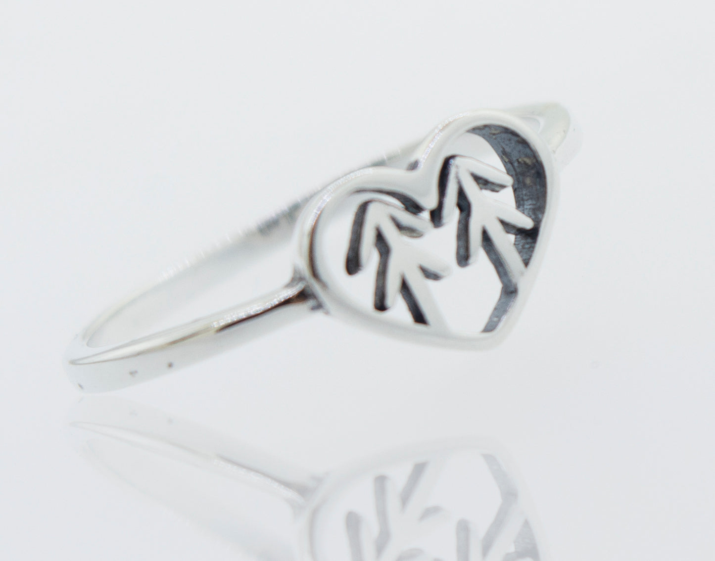 A Heart With Trees Silver Ring with a pine tree in the middle, representing love and nature.