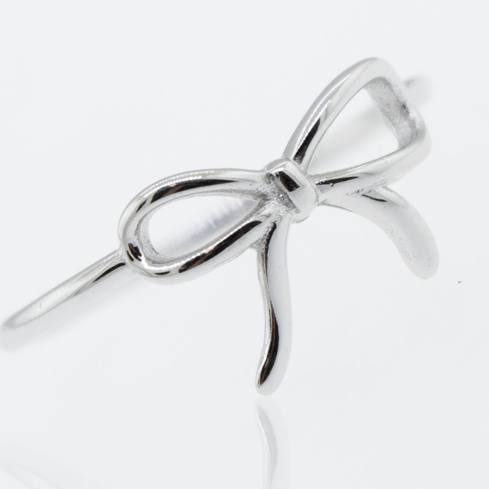 
                  
                    A Super Silver Ribbon Bow Ring on a white surface.
                  
                