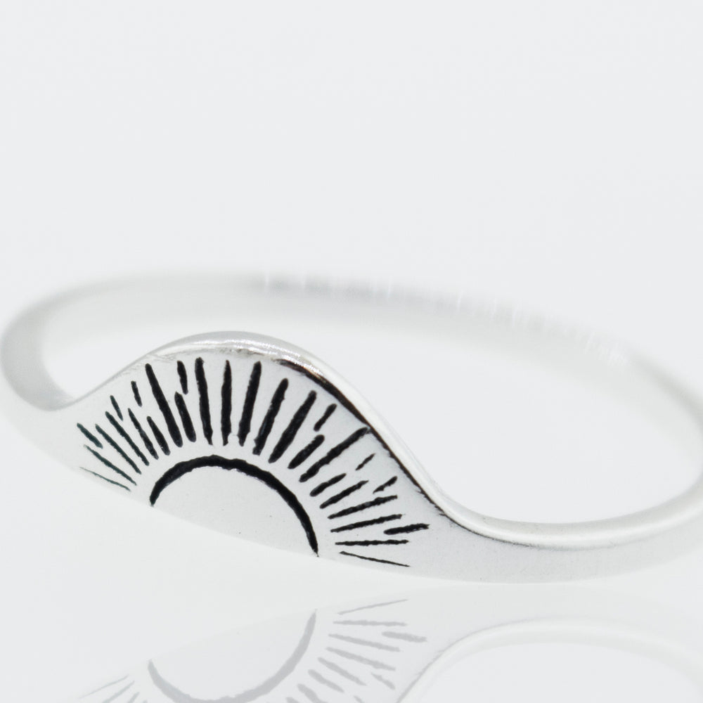 A Super Silver Sunrise Ring with a sunburst design, featuring a high shine finish.
