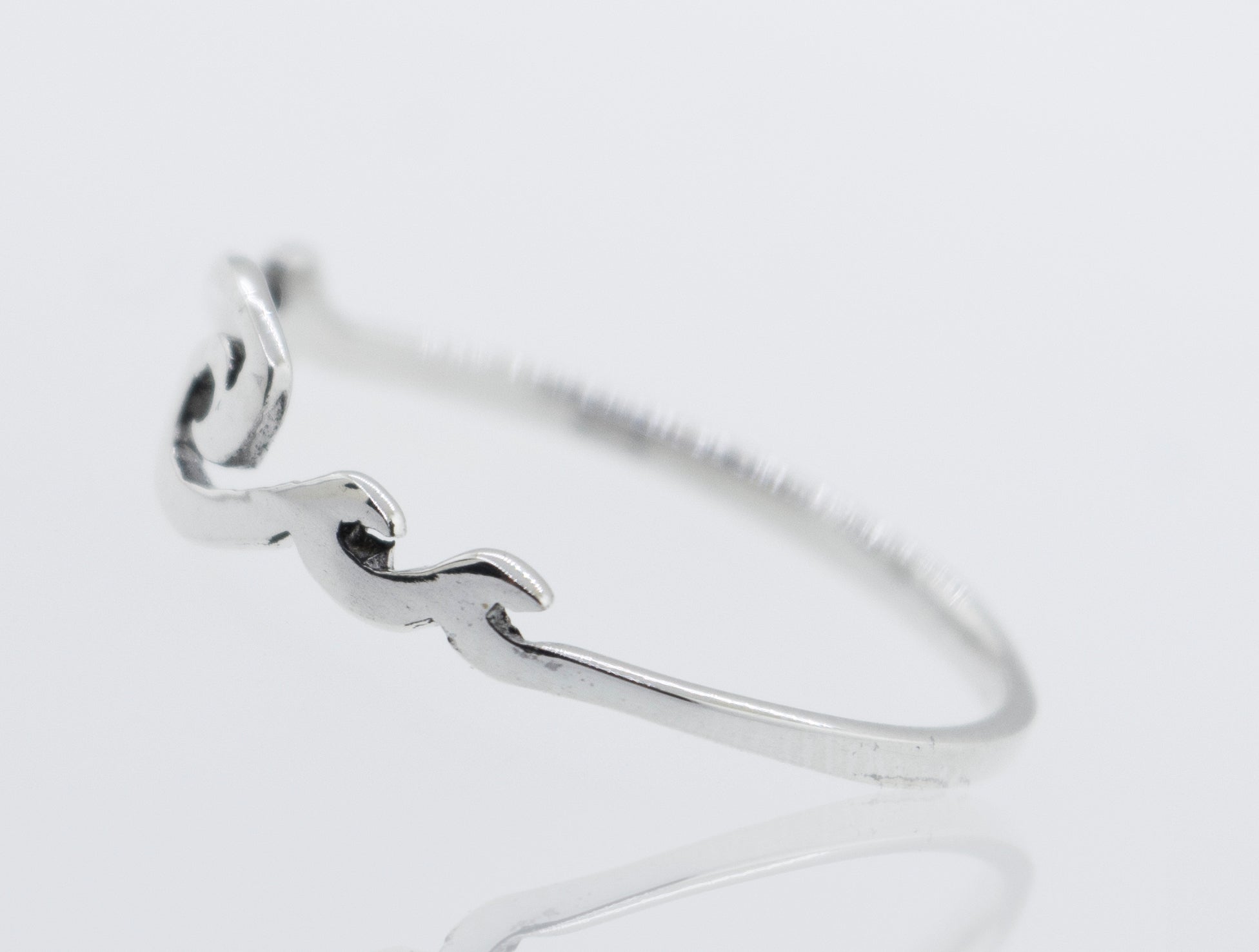 A modern Wave Ring with a minimalist heart design.