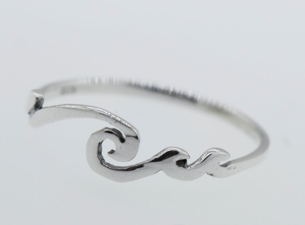 
                  
                    A modern sterling silver Wave Ring with a minimalist wave design.
                  
                