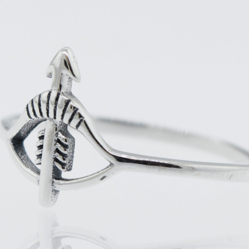 A Bow and Arrow Ring from Super Silver, made with 925 sterling silver and a high polish finish, featuring a subtle bow and arrow design.