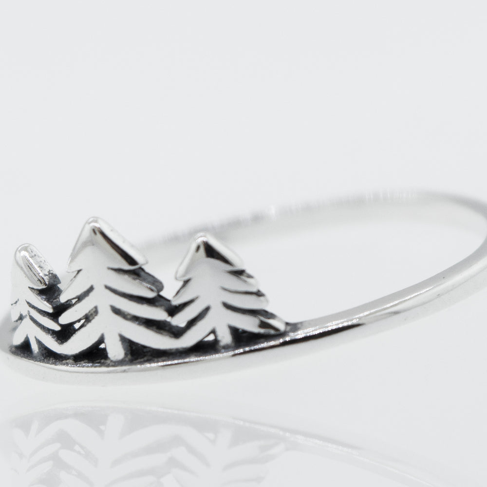 
                  
                    A silver Trees Ring with a pine tree in the middle.
                  
                
