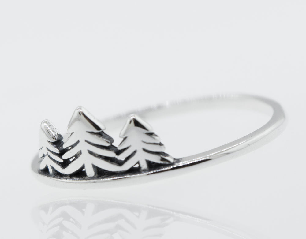A silver Trees Ring with a pine tree in the middle.