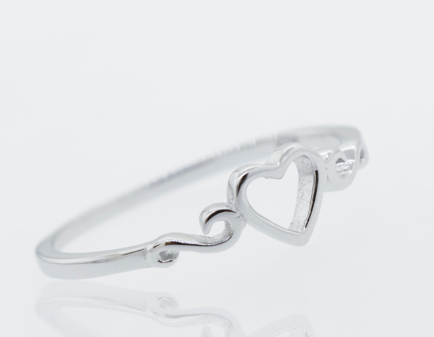 An engagement ring, named the Simple Open Heart Ring, crafted from sterling silver, featuring a heart-shaped design.