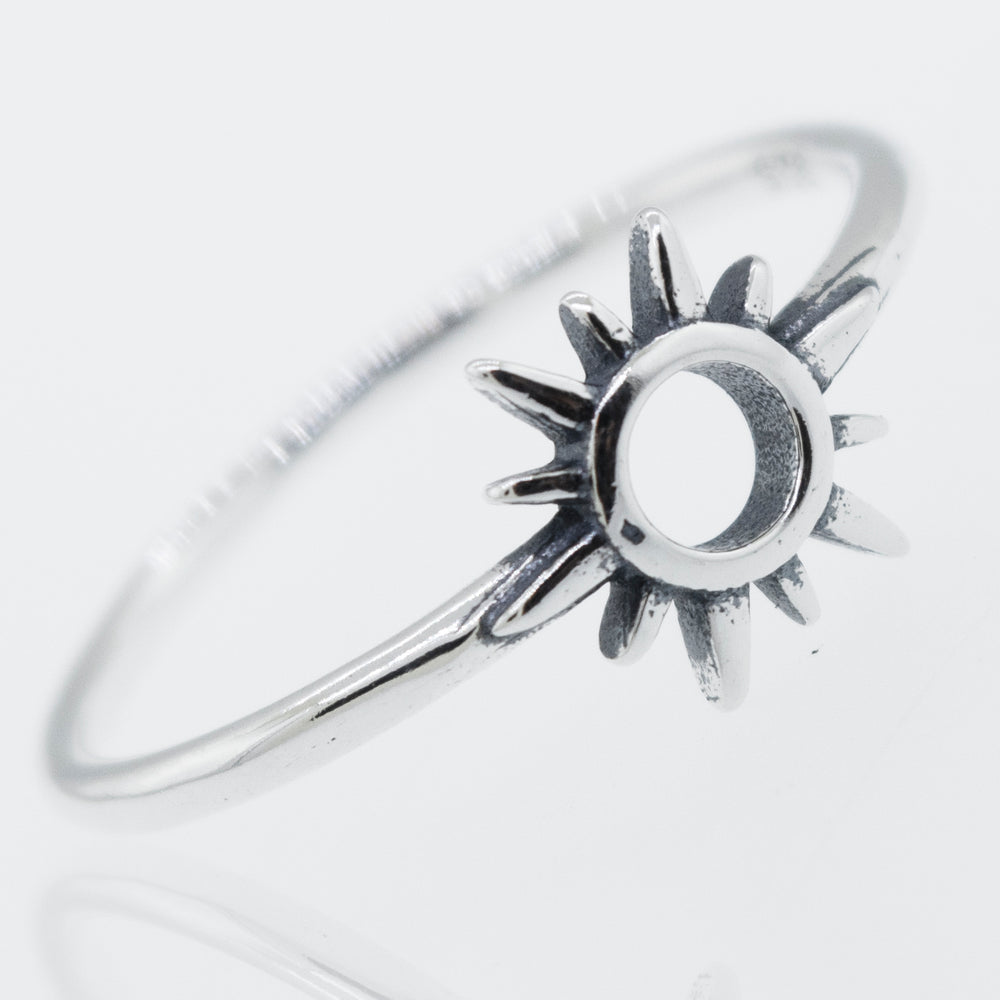 A Super Silver Sterling silver ring adorned with a Sun Ring Cutout In Center design.