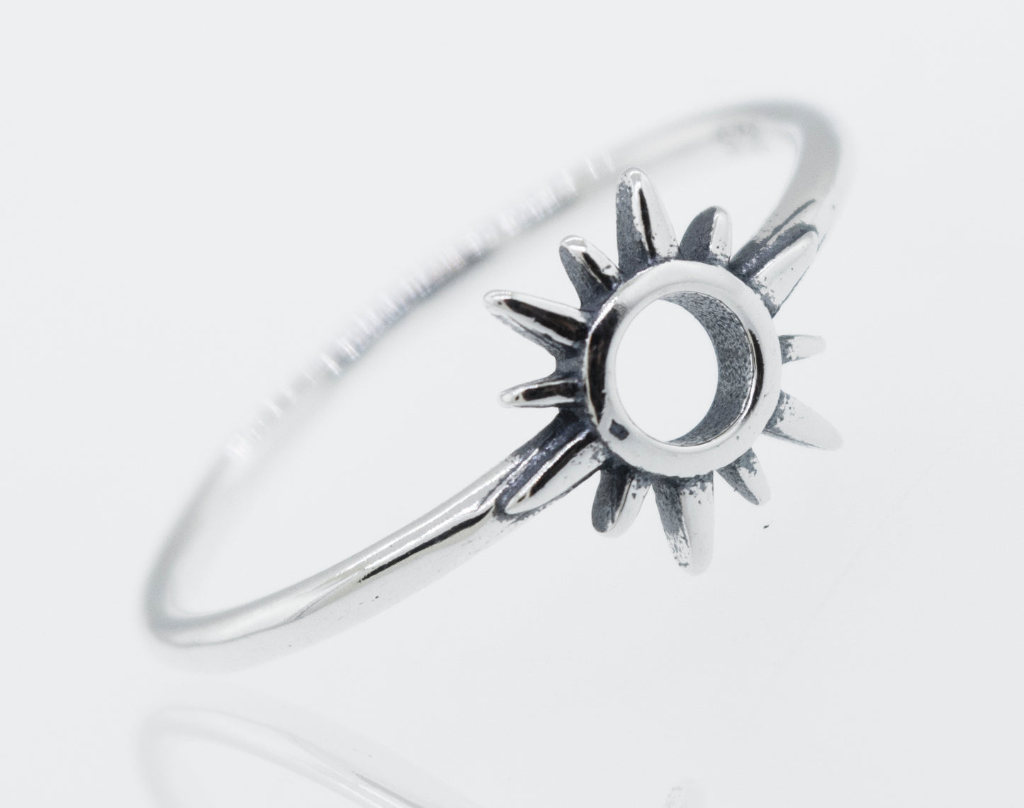 A Super Silver Sterling silver ring adorned with a Sun Ring Cutout In Center design.