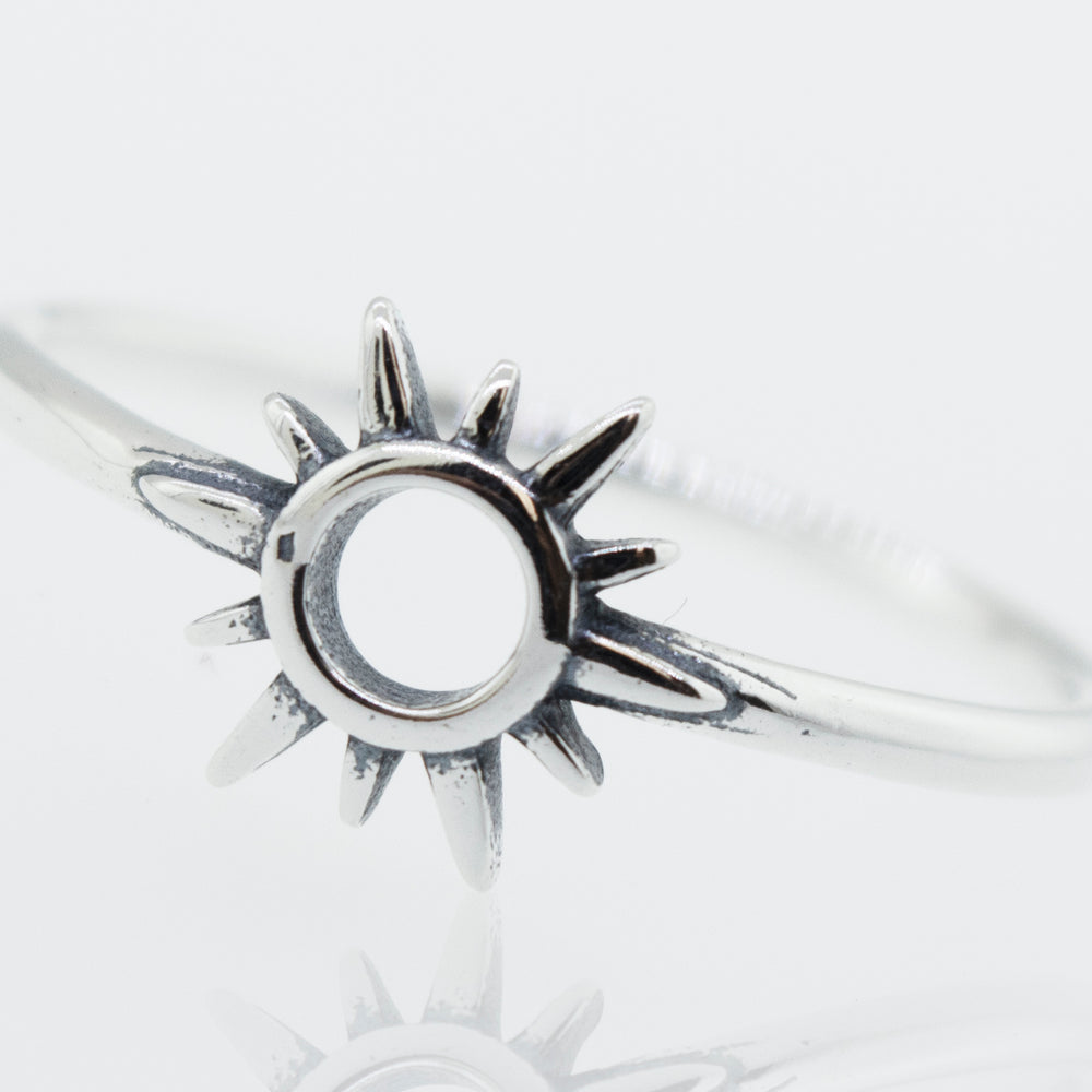 A Super Silver Sun Ring Cutout In Center with a sunburst design.