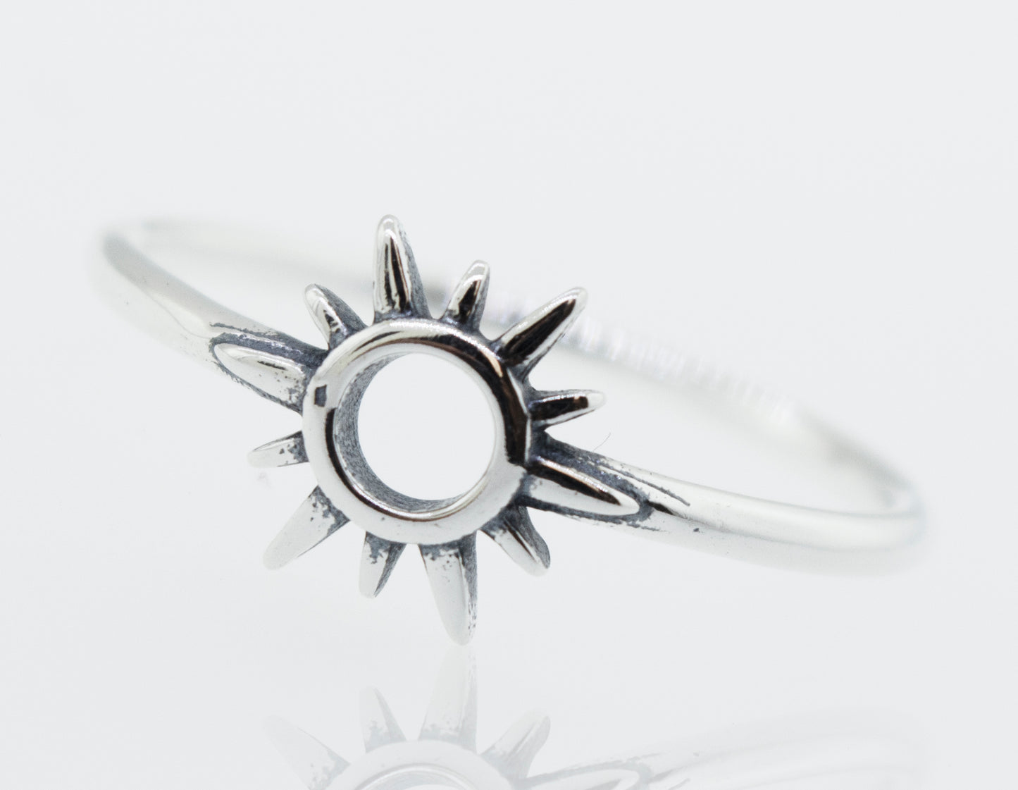 A Super Silver Sun Ring Cutout In Center with a sunburst design.