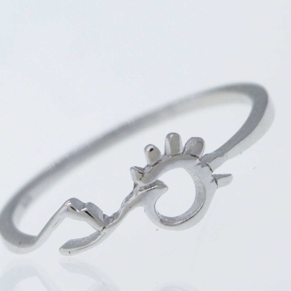 
                  
                    A Mountain and Sun Ring by Super Silver, a 925 sterling silver ring with an arrow on it.
                  
                