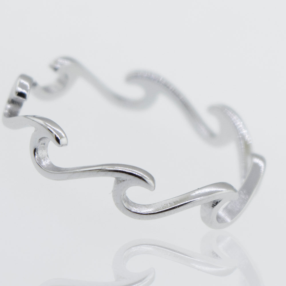 A minimalist Wave Ring with a wave design, inspired by the ocean.