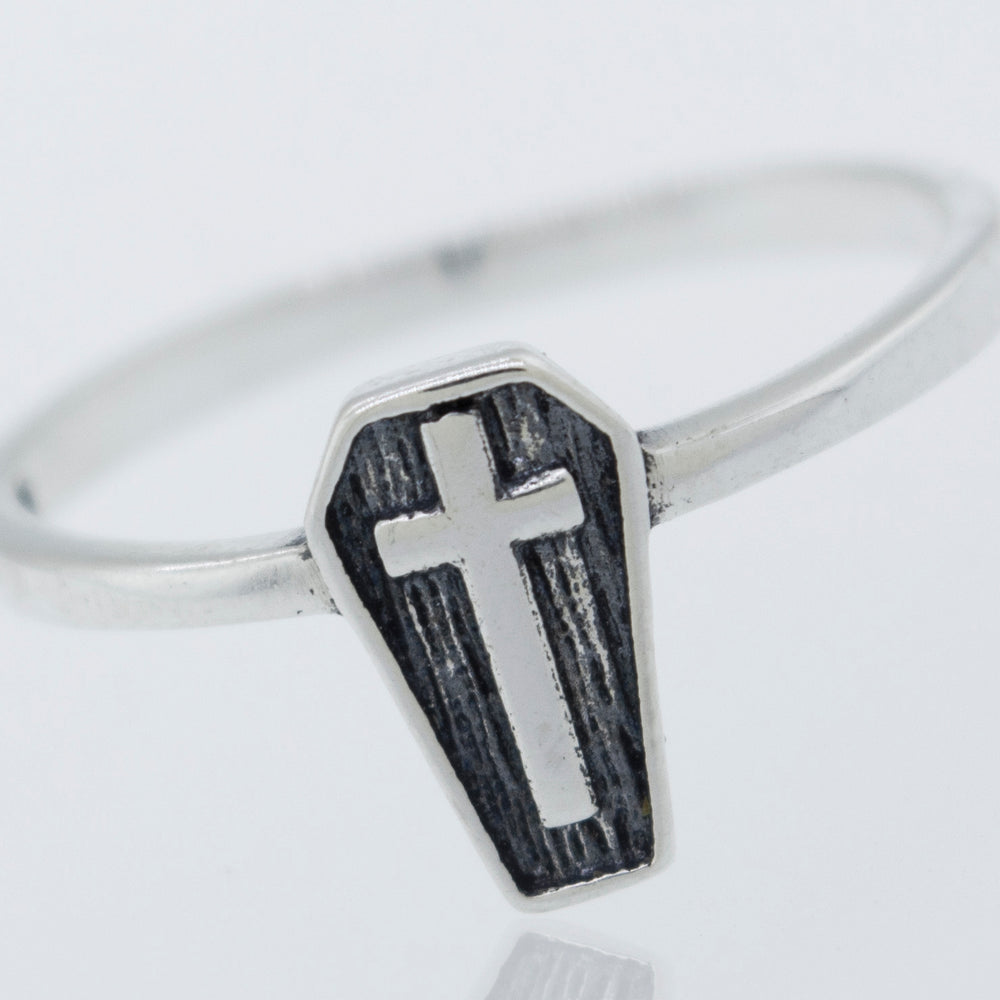 
                  
                    A gothic Coffin Ring with a cross on it.
                  
                