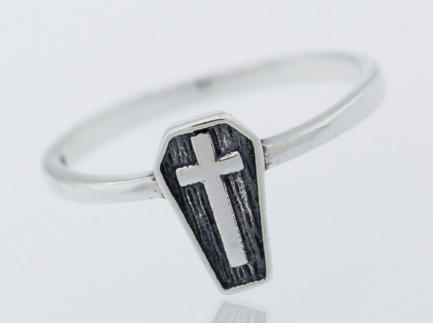 A gothic Coffin Ring with a cross on it.