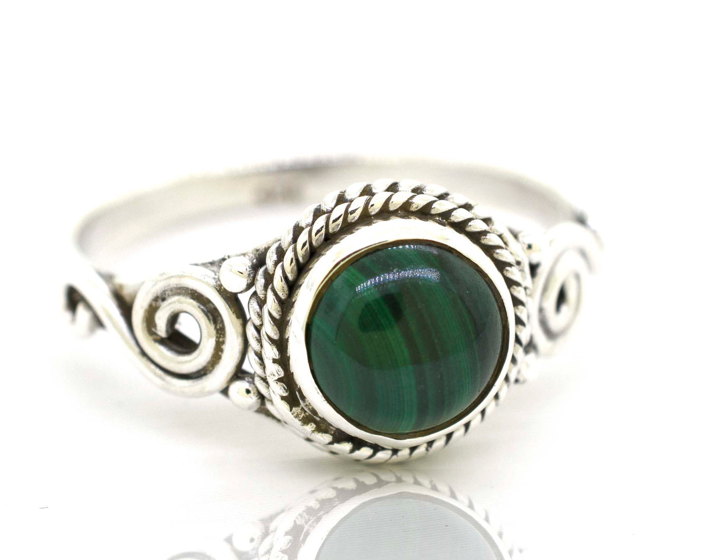 
                  
                    A Gemstone Circle Ring With Rope Border And Swirl Design, radiating a bohemian vibe.
                  
                