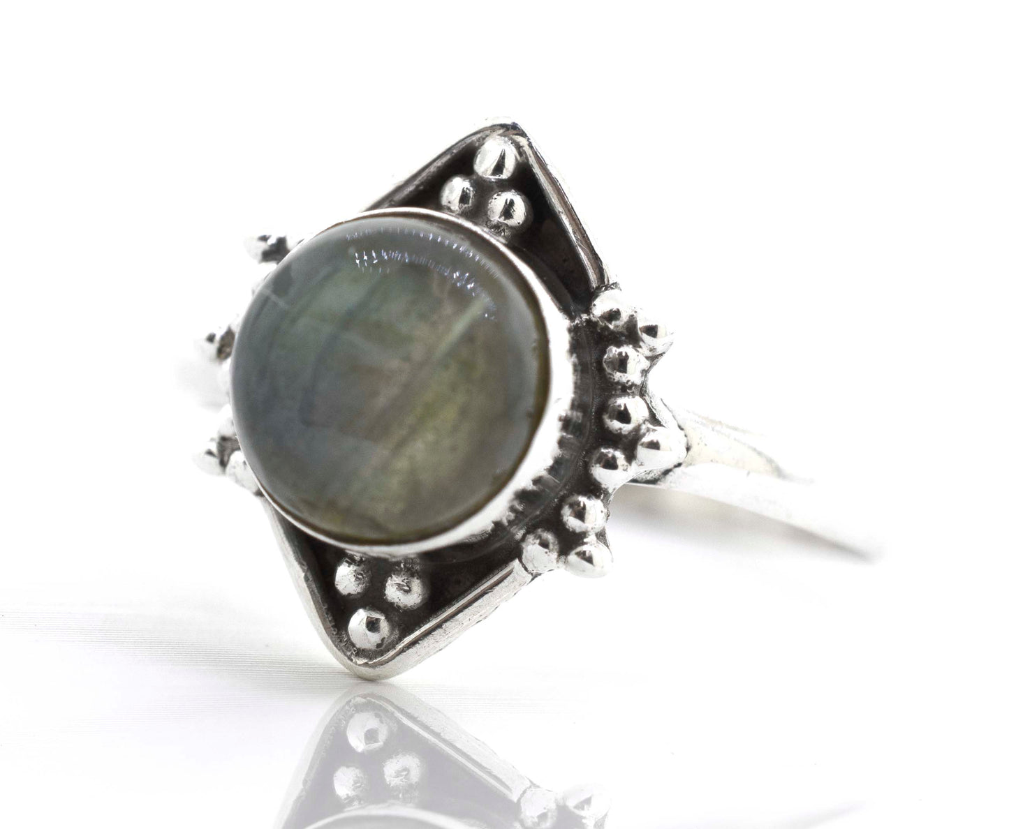 
                  
                    A Super Silver Round Gemstone Ring With Oxidized Diamond Shape Pattern adorned with a mesmerizing labradorite gemstone.
                  
                