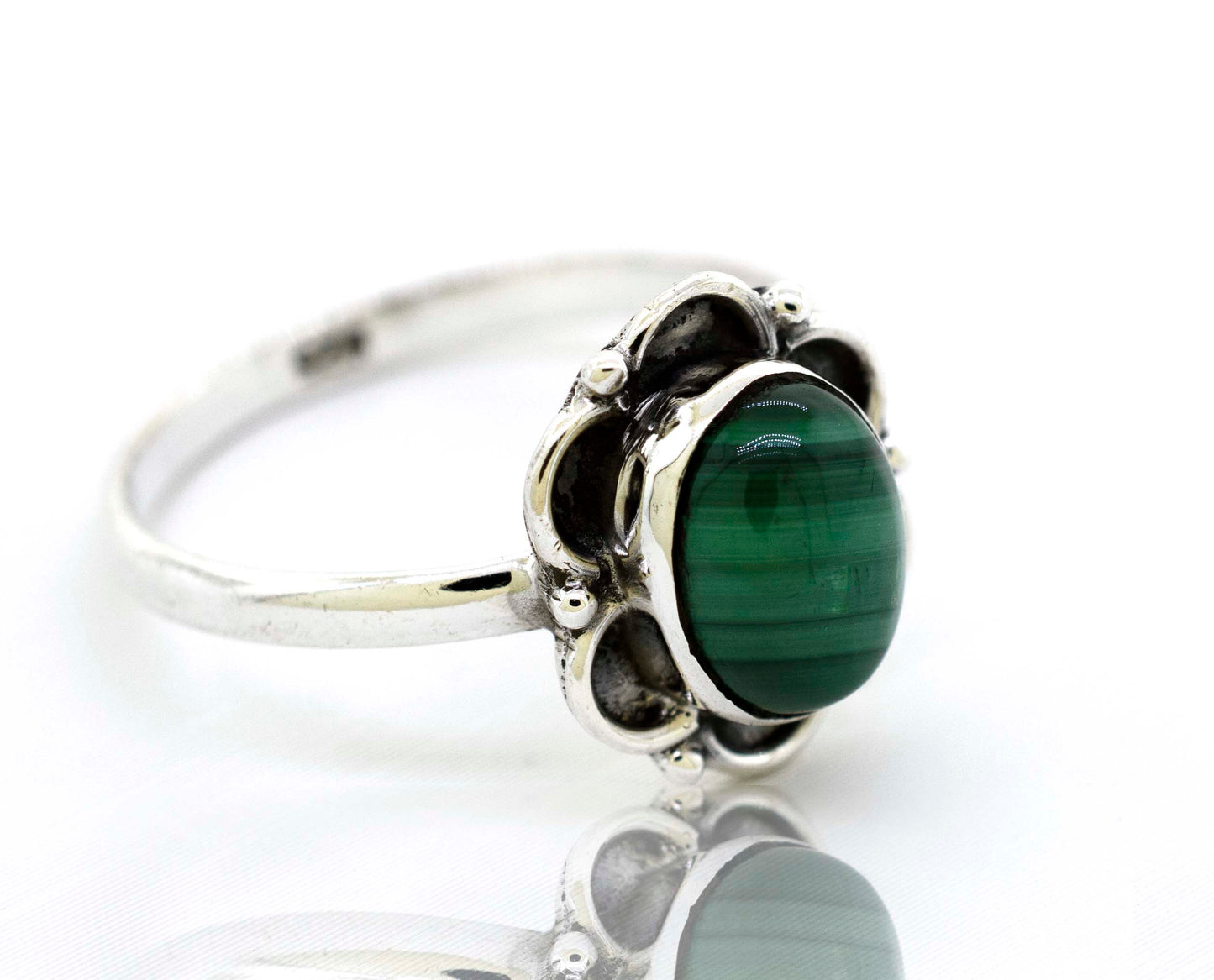
                  
                    A delicate Gemstone Ring With Oxidized Flower Design by Super Silver with a central green malachite gemstone and silver petals.
                  
                