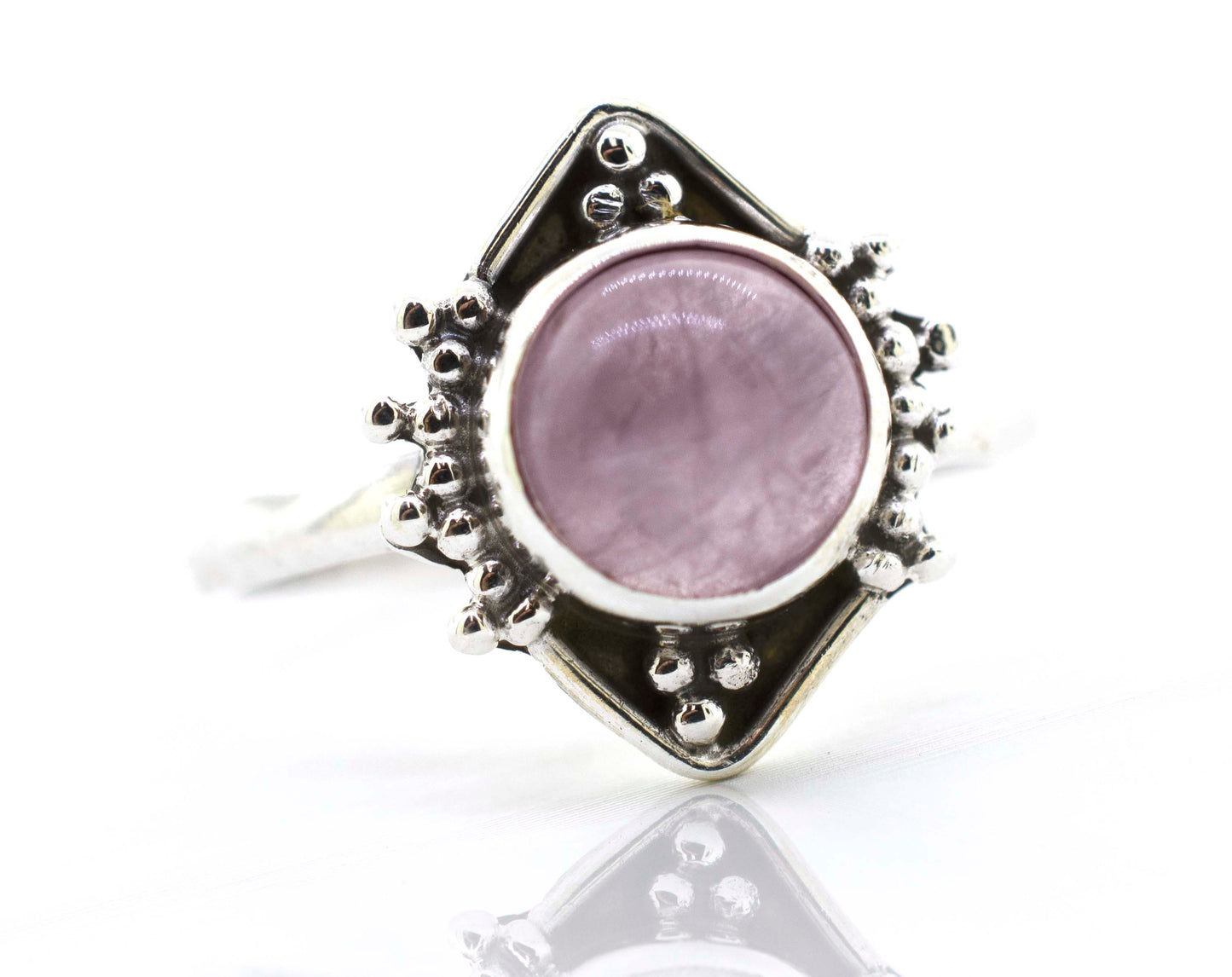 
                  
                    A Super Silver round gemstone ring with oxidized diamond shape pattern in the center.
                  
                