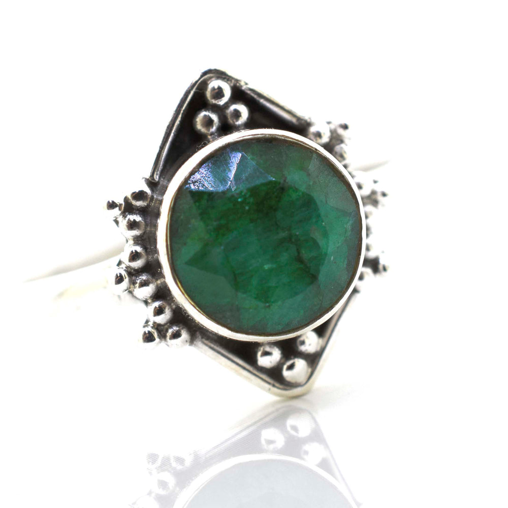 
                  
                    A Super Silver round gemstone ring with oxidized diamond shape pattern, beautifully placed on a pristine white surface.
                  
                