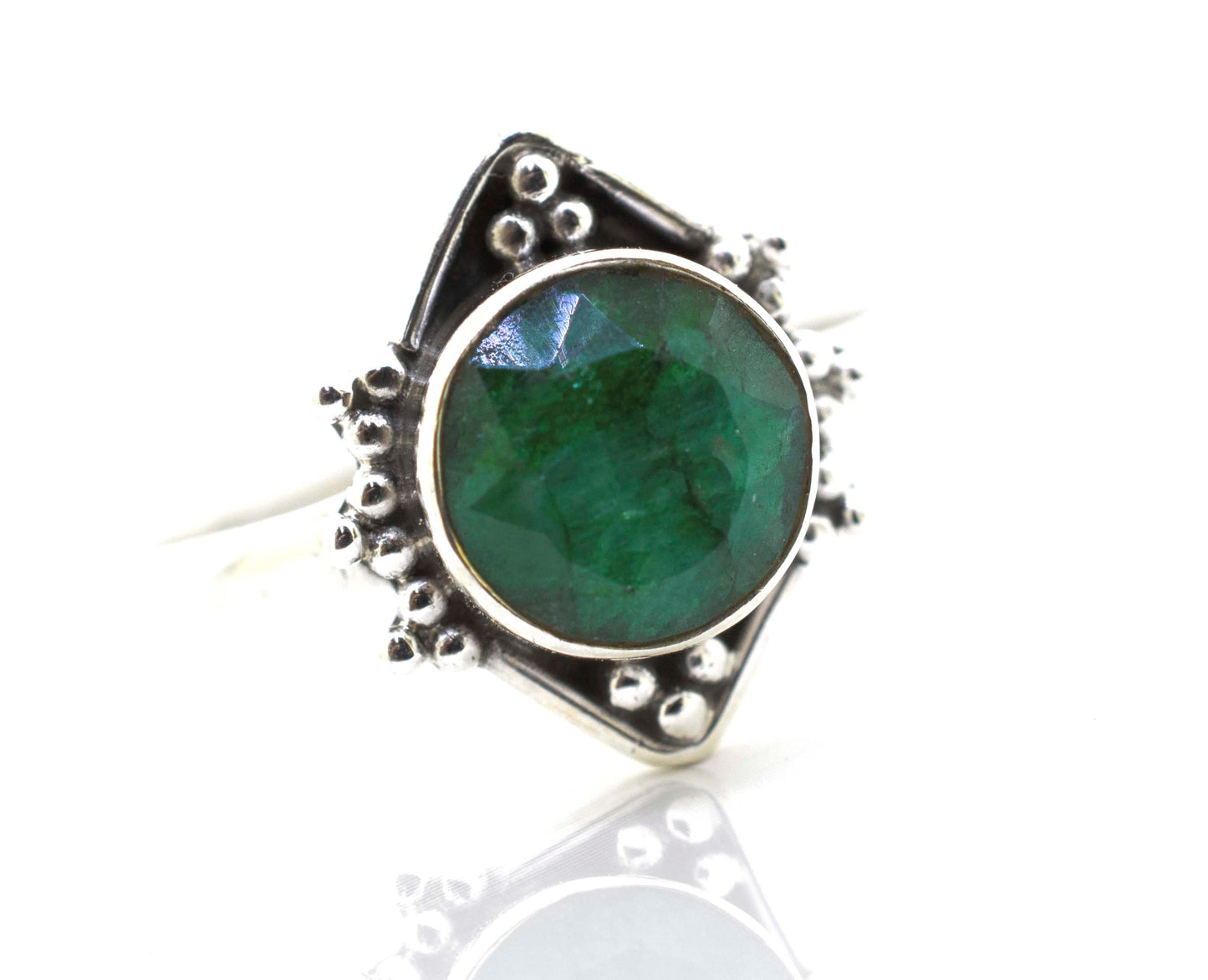
                  
                    A Super Silver round gemstone ring with oxidized diamond shape pattern, beautifully placed on a pristine white surface.
                  
                