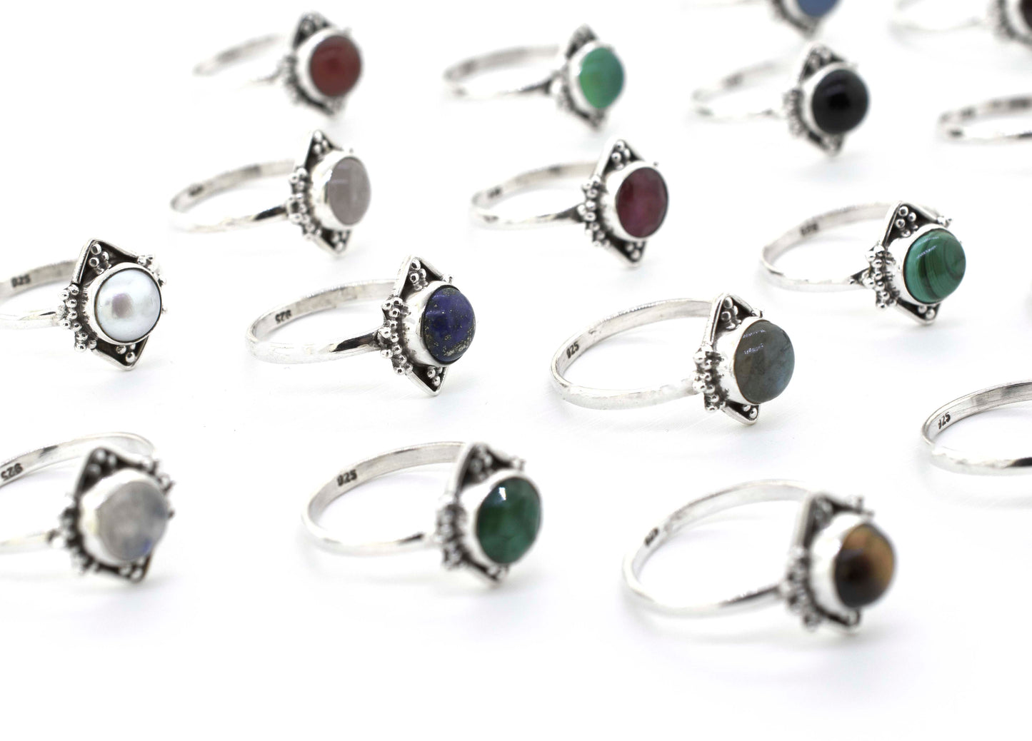 A group of Round Gemstone Rings With Oxidized Diamond Shape Pattern with different colored stones.