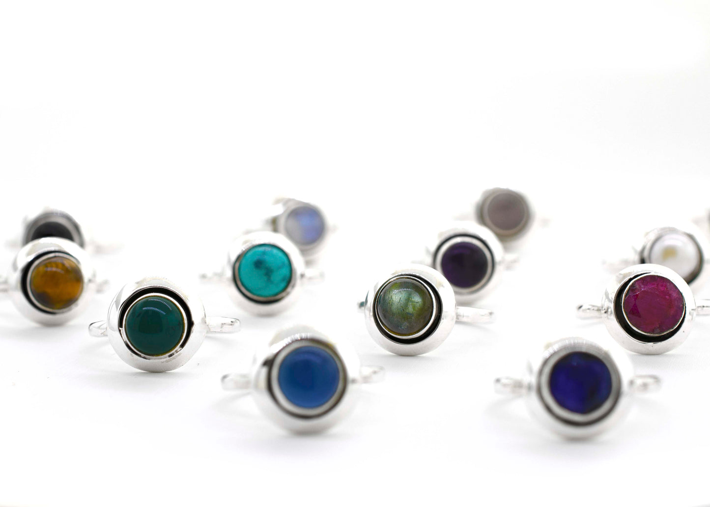 A boho-inspired collection of Round Gemstone Rings With Oxidized Outline, featuring various colored stones crafted in sterling silver, perfect for the free-spirited hippie.