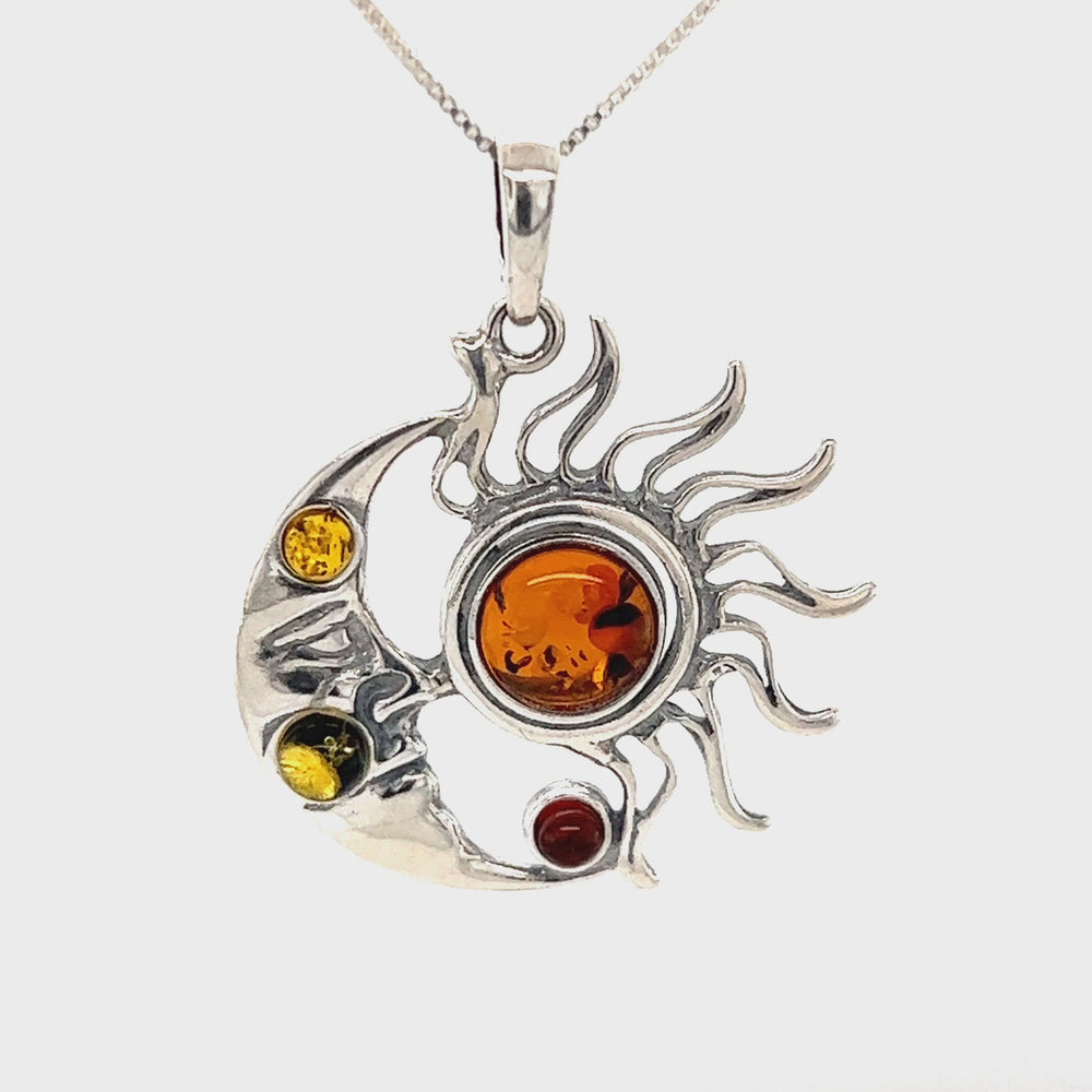 
                  
                    Load and play video in Gallery viewer, Magical Sun and Moon Amber Pendant
                  
                