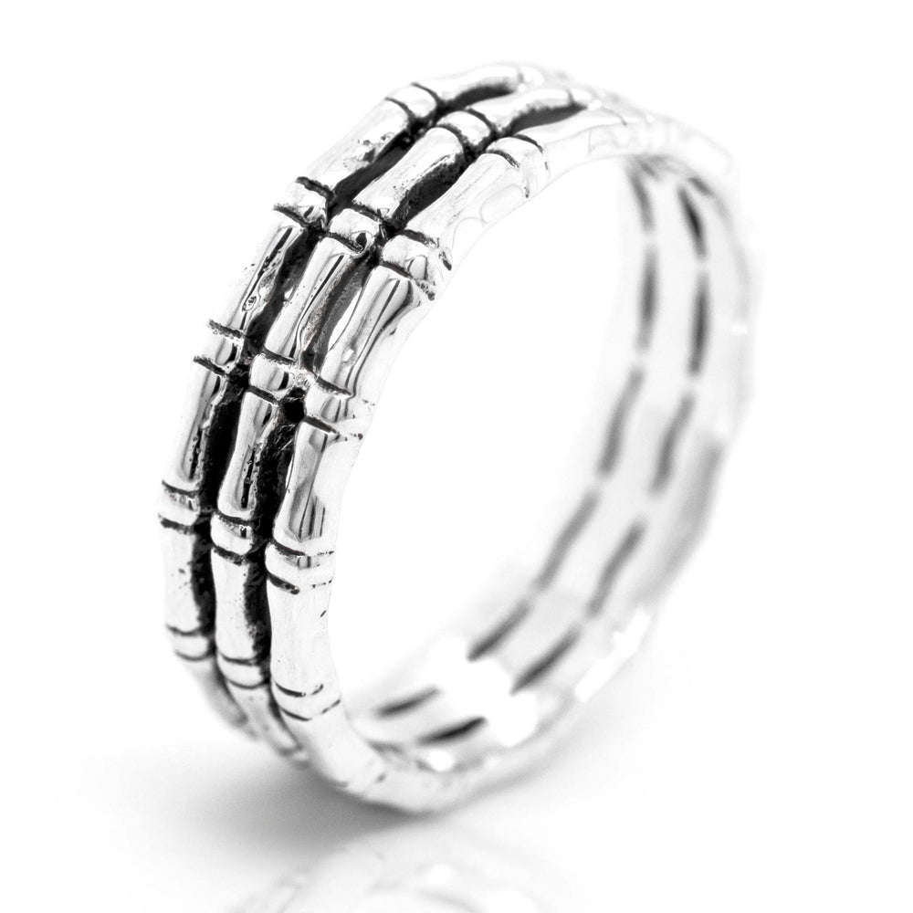 
                  
                    A Triple Bamboo Band Ring with a bamboo design, from Super Silver.
                  
                