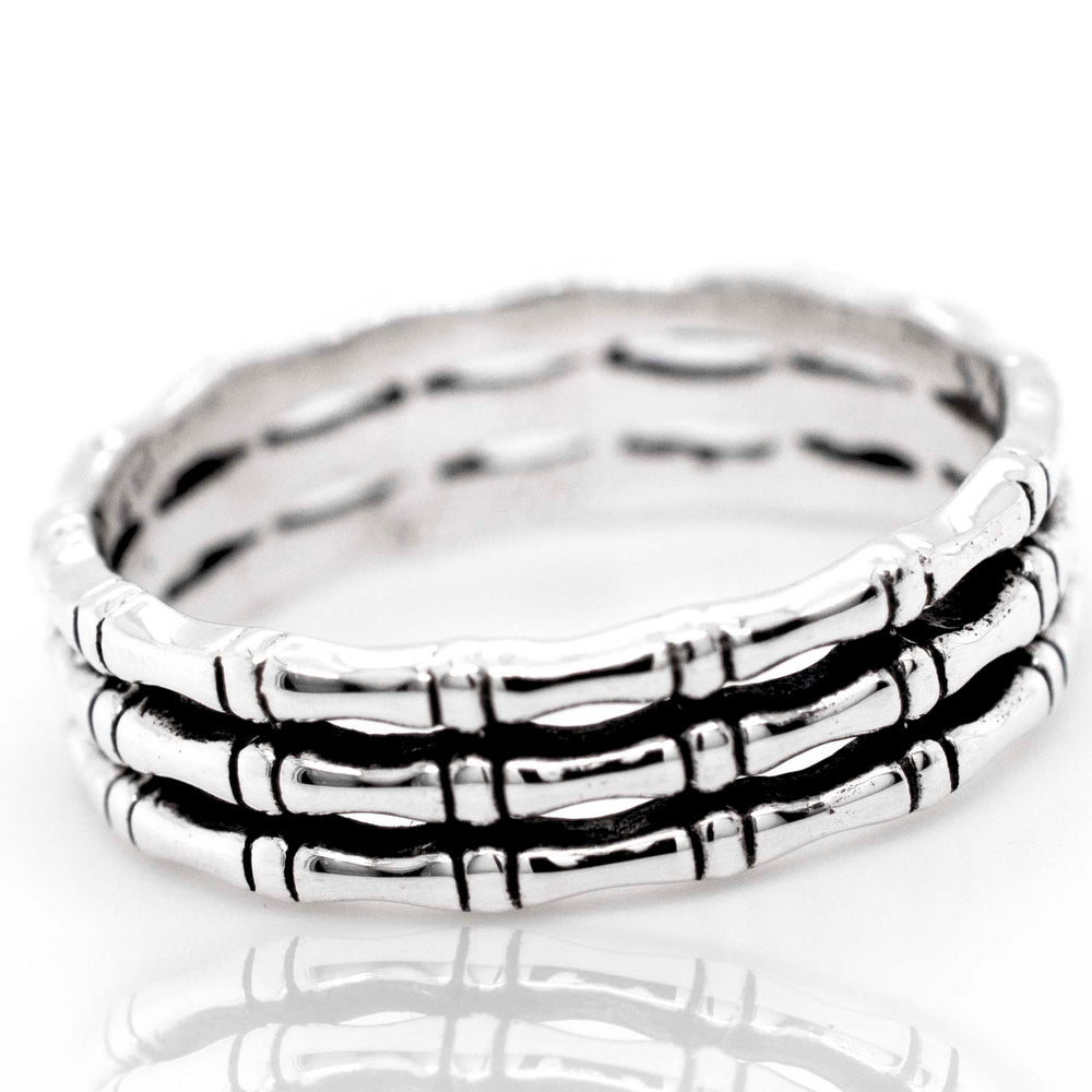 
                  
                    A minimalist style Super Silver Triple Bamboo Band Ring.
                  
                