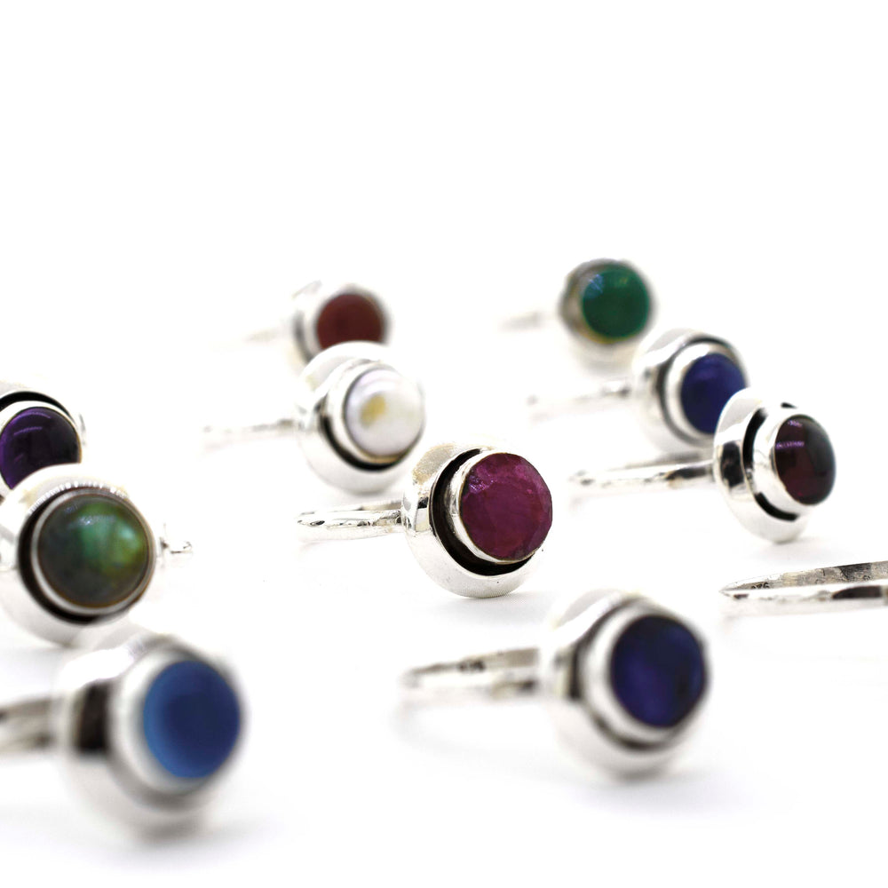 
                  
                    A group of Round Gemstone Rings With Oxidized Outline crafted from sterling silver.
                  
                