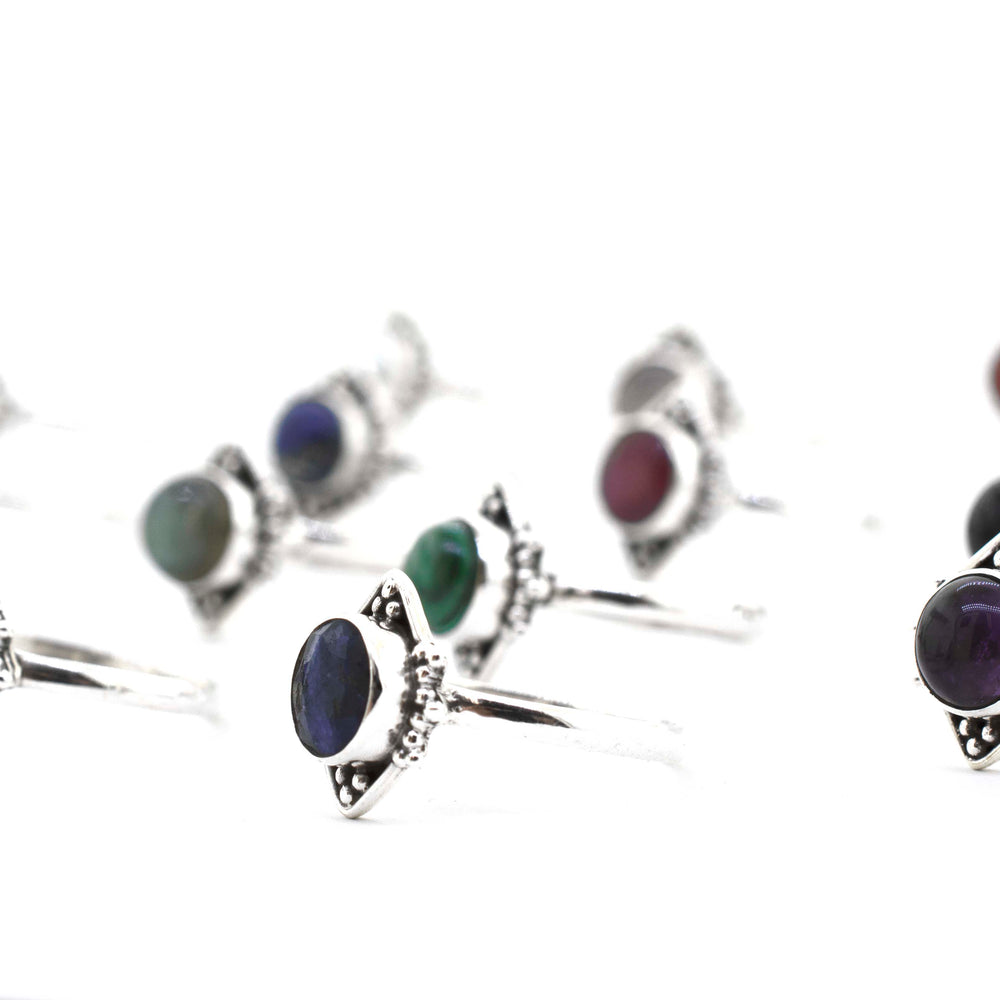 
                  
                    A group of Round Gemstone Rings With Oxidized Diamond Shape Pattern on a white surface.
                  
                