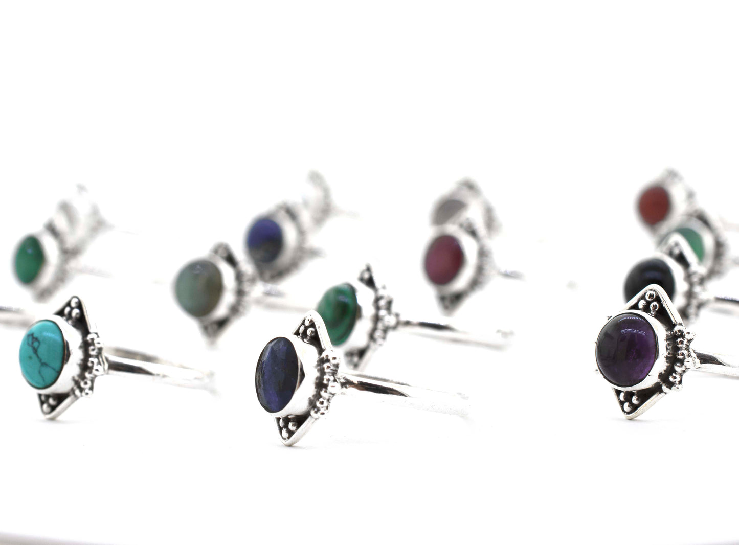 
                  
                    A group of Round Gemstone Rings With Oxidized Diamond Shape Pattern on a white surface.
                  
                