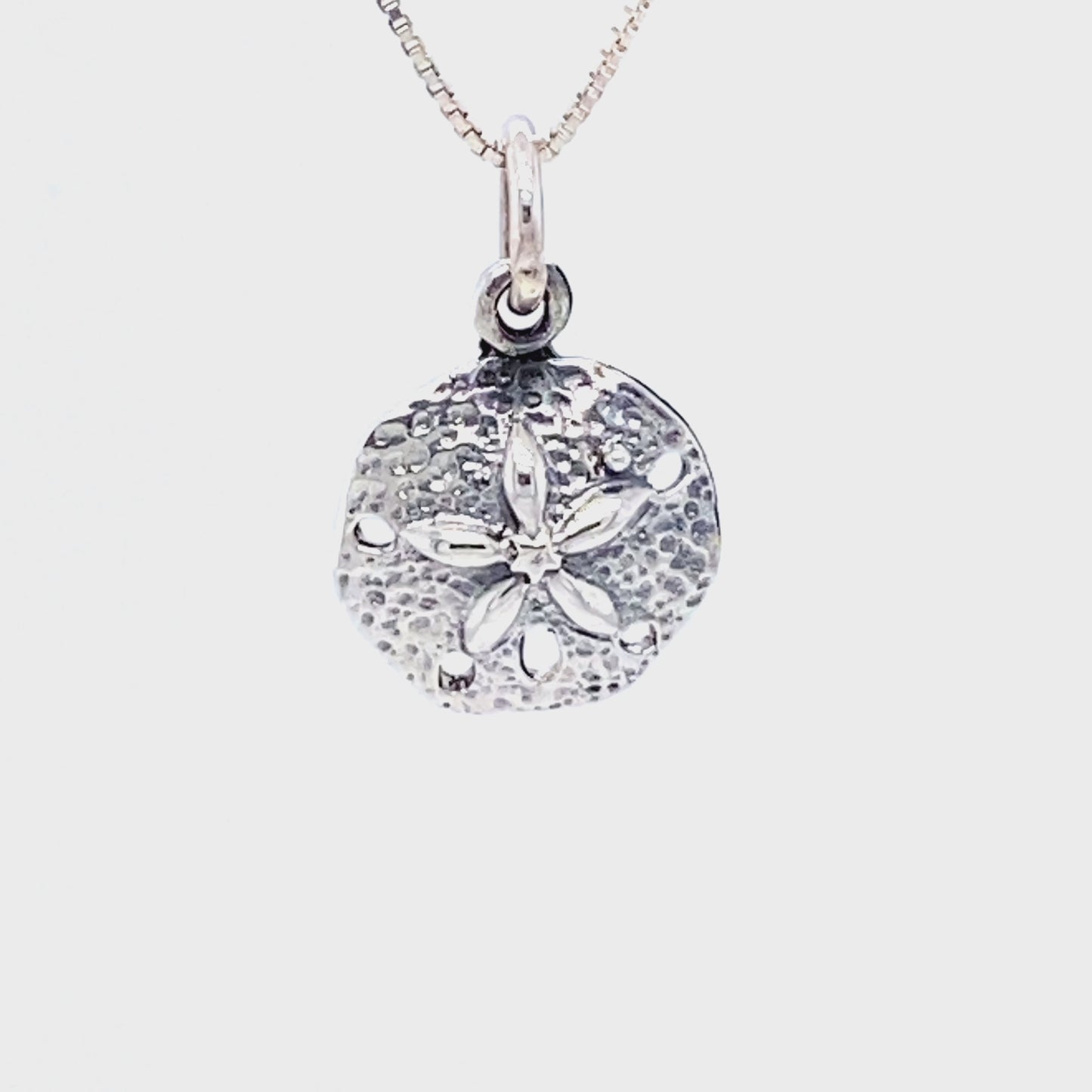 
                  
                    Load and play video in Gallery viewer, Petite Sand Dollar Charm
                  
                