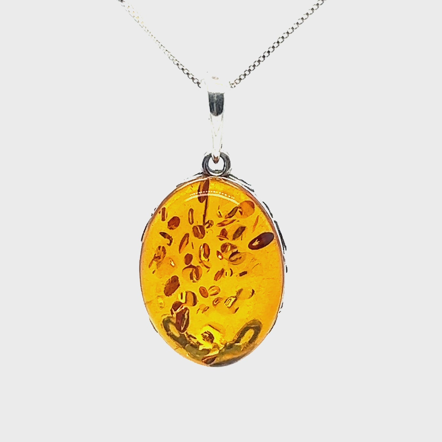 
                  
                    Load and play video in Gallery viewer, Cognac Amber Oval Pendant with Floral Border
                  
                