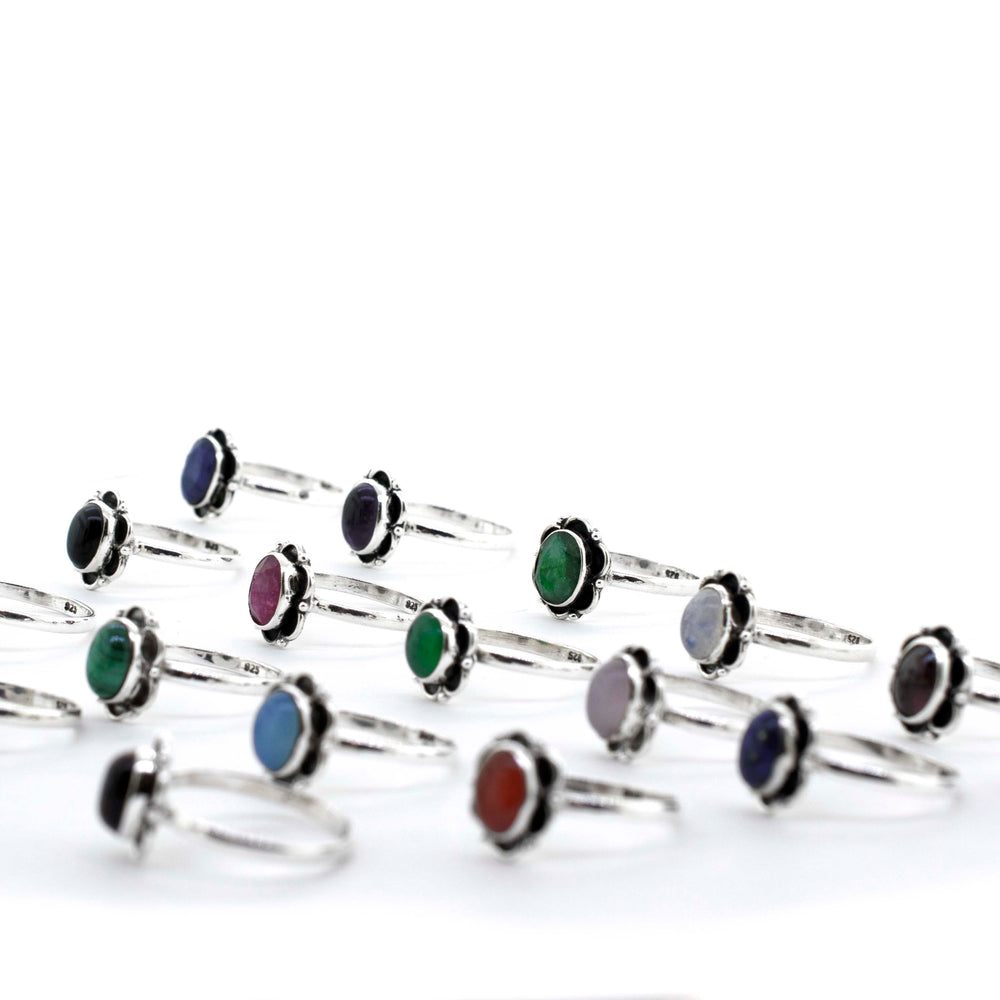 
                  
                    A group of Gemstone Rings With Oxidized Flower Design, featuring Santa Cruz and hippie vibes.
                  
                