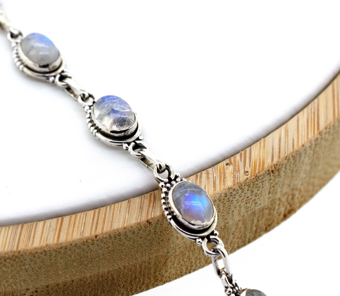 
                  
                    A Super Silver Oval Gemstone Bracelet with Half Ball Border adorned with moonstones, the perfect gemstone accessory.
                  
                