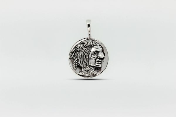 A Native Head Coin Charm pendant with a portrait of a woman by Super Silver.