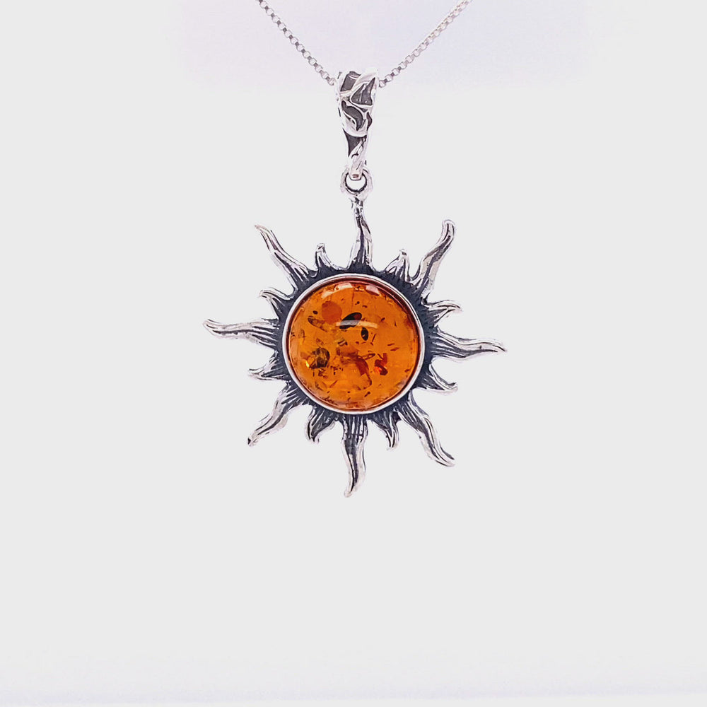 
                  
                    Load and play video in Gallery viewer, Radiant Amber Sun Pendant
                  
                