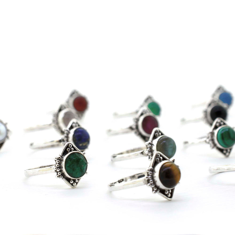 
                  
                    A boho-inspired collection of Round Gemstone Rings With Oxidized Diamond Shape Pattern featuring an array of colorful stones.
                  
                