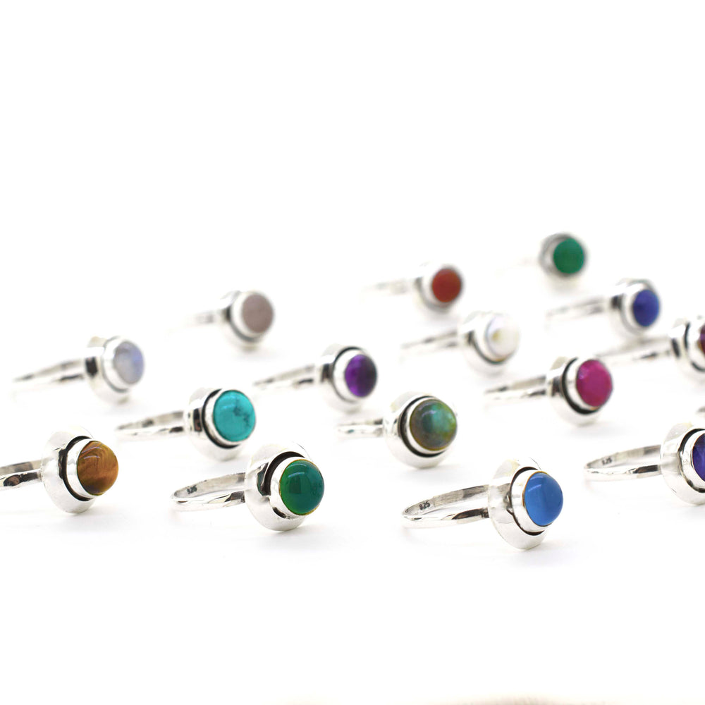 
                  
                    A group of Round Gemstone Rings With Oxidized Outline on a white background, perfect for the Santa Cruz hippie vibe.
                  
                