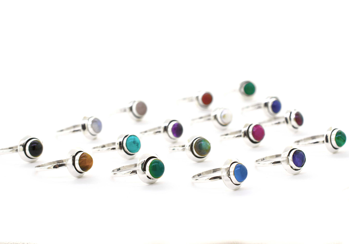 
                  
                    A group of Round Gemstone Rings With Oxidized Outline on a white background, perfect for the Santa Cruz hippie vibe.
                  
                