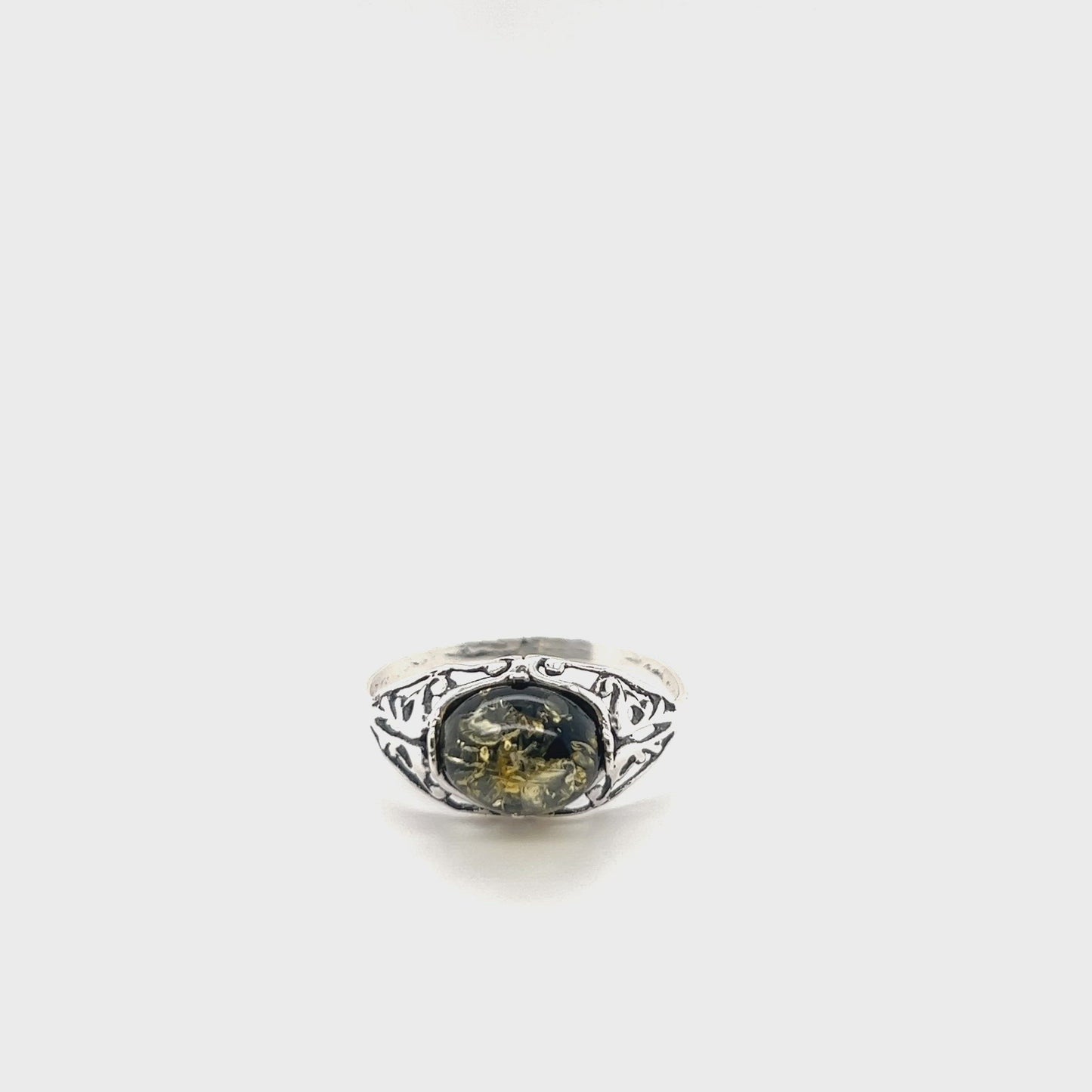 
                  
                    Load and play video in Gallery viewer, Glowing Green Baltic Amber Ring
                  
                