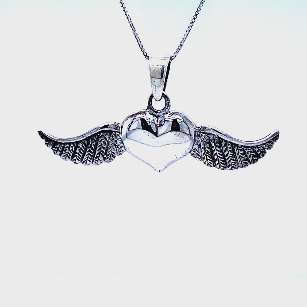 
                  
                    Load and play video in Gallery viewer, Heart With Wings Pendant
                  
                