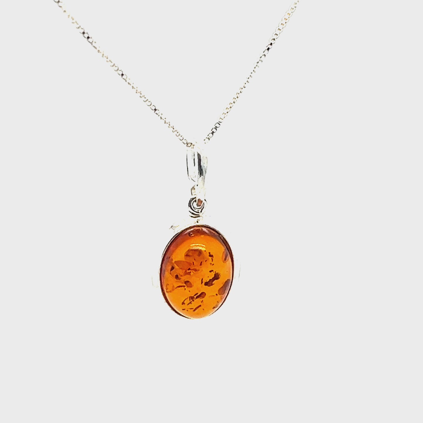 
                  
                    Load and play video in Gallery viewer, Simple Framed Oval Amber Pendant
                  
                